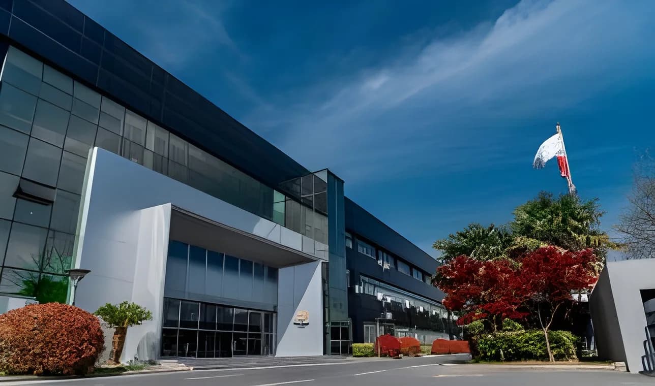 StarCharge's Changzhou I plant, a glass-fronted building with flags outside