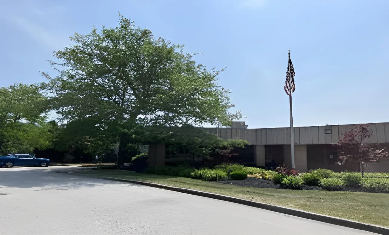 The Columbus, Ohio plant behind a lawn, with a US flag
