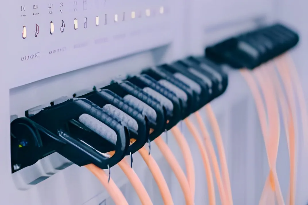 Charging connectors and orange cables lined up on the production line